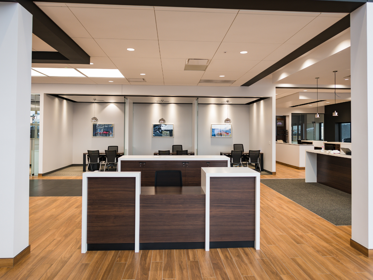 Garlyn Shelton Mazda dealership interior with wooden flooring and modern desks