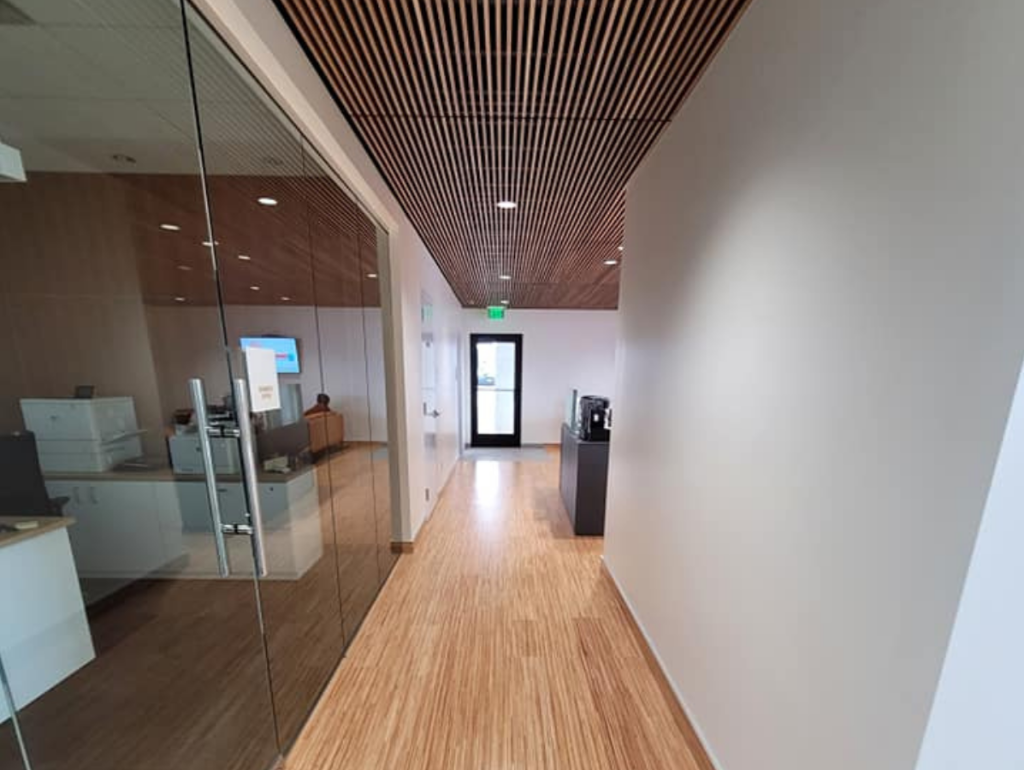 modern Volvo dealership Passage area with wooden flooring and ceiling