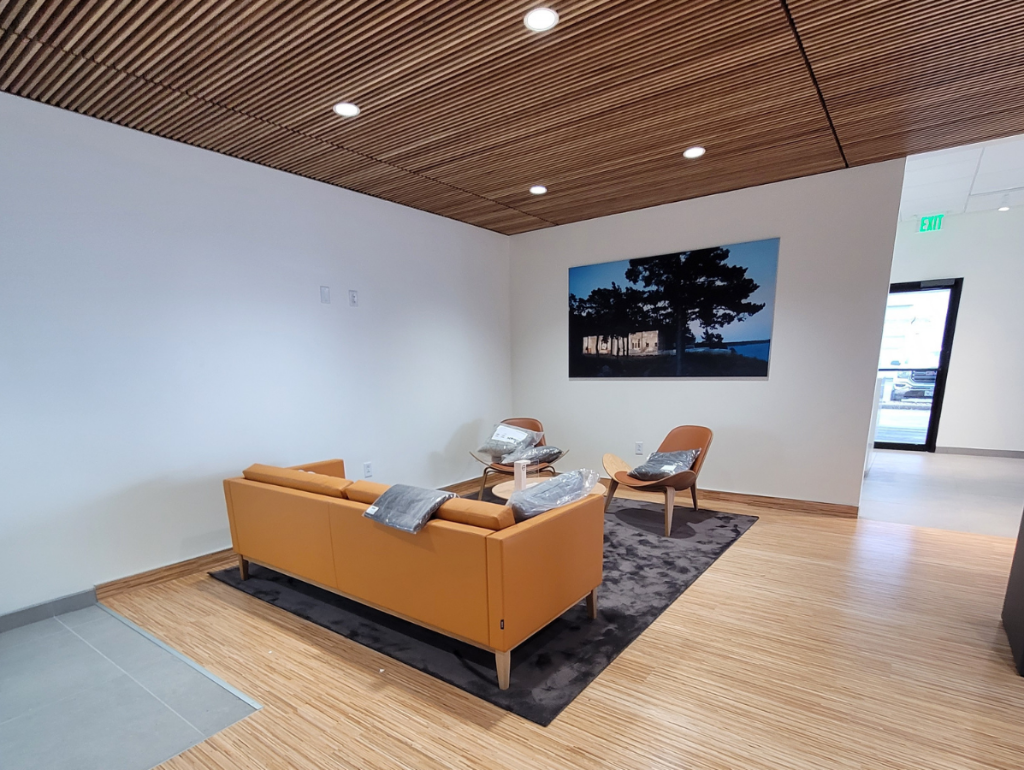 modern Volvo dealership Lobby area with wooden flooring and ceiling